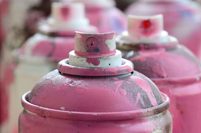 Close-up of pink spray bottles