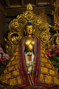 Buddha statue in temple outside building