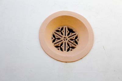 Directly above shot of potted plant against white wall