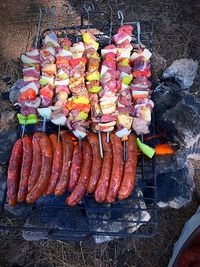 High angle view of meat on barbecue grill