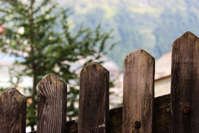 Close-up of wooden fence against the sky