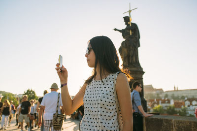 Woman photographing through camera