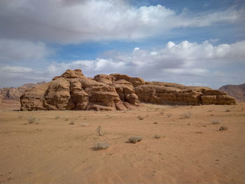 Rock formations on landscape against sky