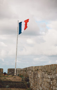 Low angle view of french flag against sky