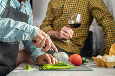 Midsection of man working on table