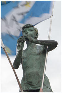 Close-up of statue against sky