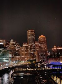 Illuminated buildings in city at night