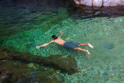 High angle view of person swimming in sea