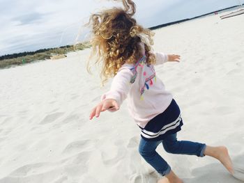 Child running on beach
