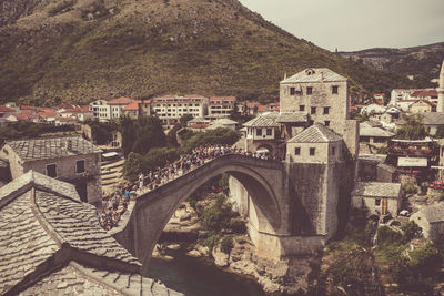 High angle view of buildings in town against sky