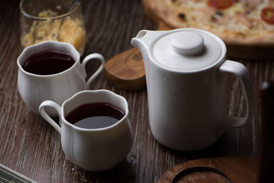 Tea cup and coffee on table