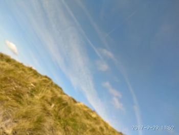 Low angle view of vapor trail against sky