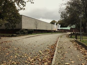 Railroad track amidst trees against sky