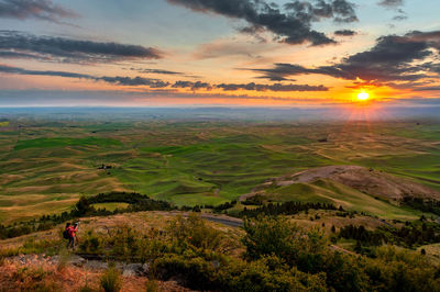 Scenic view of landscape against sky during sunset