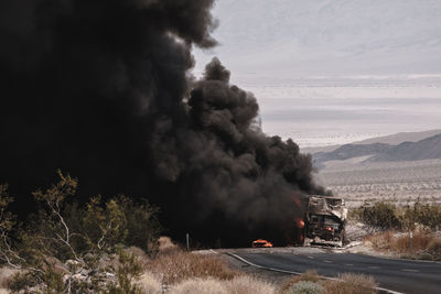 Massive explosion on the road against sky