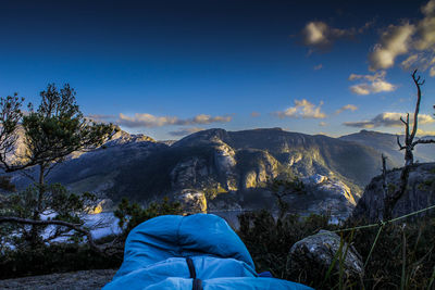 Man on snowcapped mountain against sky