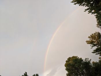 Low angle view of rainbow against sky