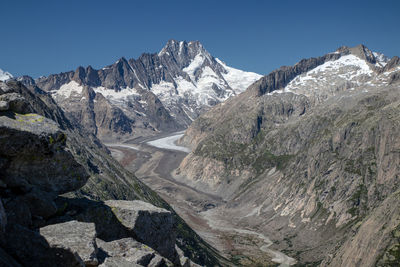 Sunny morning panorama on the top of grimselpass. colorful summer in swiss alps, canton of bern