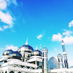 Low angle view of building against blue sky