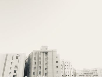 Low angle view of buildings against clear sky