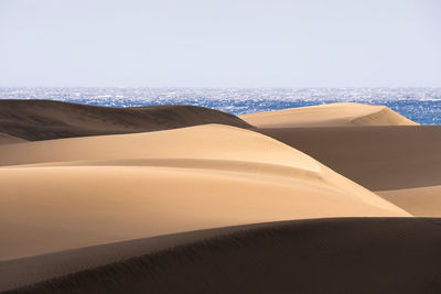 Scenic view of desert against clear sky