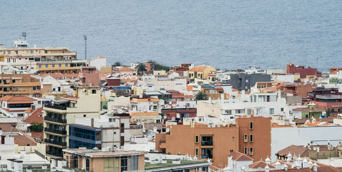 Houses in city against sky