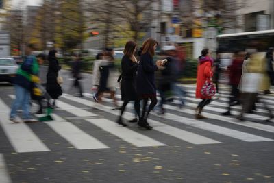 People walking on street in city