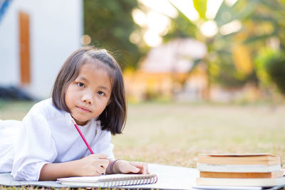 Portrait of a girl sitting on table