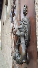 Close-up of statue against wall