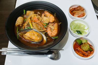 Closeup jjamppong or jjampong korean spicy seafood noodle soup