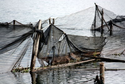 High angle view of fishing nets tied in sea