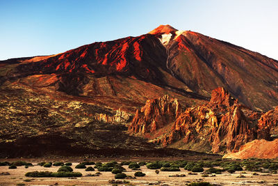 Scenic view of rocky mountains at el teide national park against clear sky