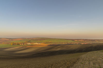 Scenic view of landscape against sky during sunset