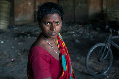 Portrait of woman standing outdoors