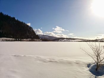 Scenic view of landscape against sky during winter