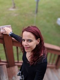 Portrait of woman standing on steps