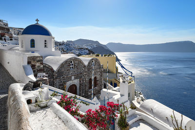 Panoramic view of sea and buildings against sky