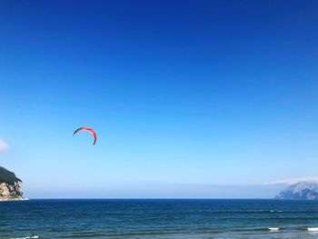 Scenic view of sea against clear blue sky