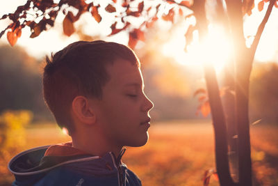 Close-up portrait of boy looking away