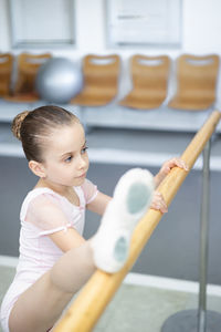 Portrait of cute girl playing with toy