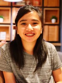 Portrait of smiling woman at home