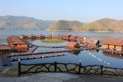 Scenic view of river and mountains against clear sky
