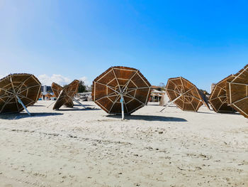 Beach umbrellas on the sand at the final of the summer in mamaia constanta