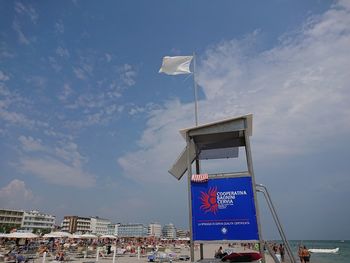 Traditional windmill against sky in city