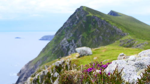 Scenic view of sea and rocks against sky