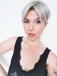 Portrait of a beautiful young woman over white background