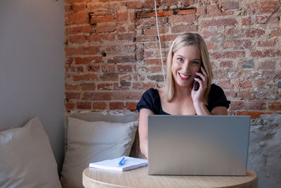 Woman using laptop at office