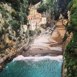 Panoramic view of sea and buildings against trees