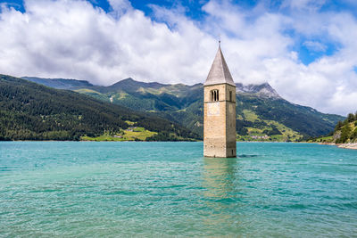 Scenic view of sea and buildings against sky