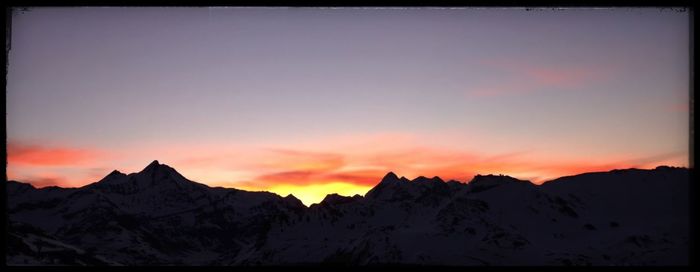 Scenic view of mountains at sunset